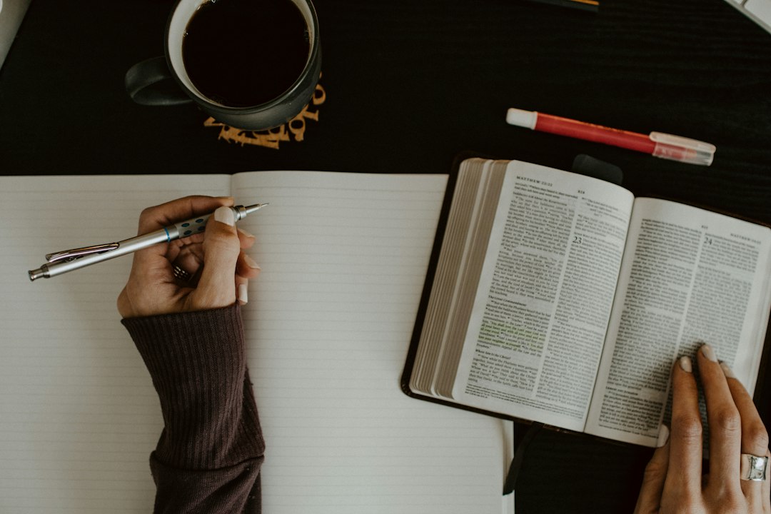 Open Bible and notebook for studying Bible verses about stewardship
